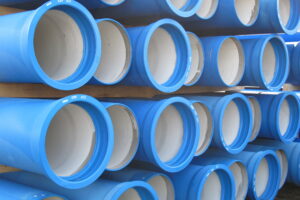 piles of concrete pipes for transporting water and sewerage